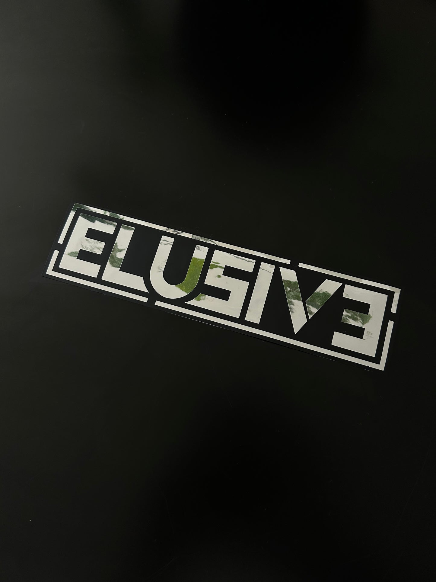 Elusive Chrome on Black Slap Sticker
